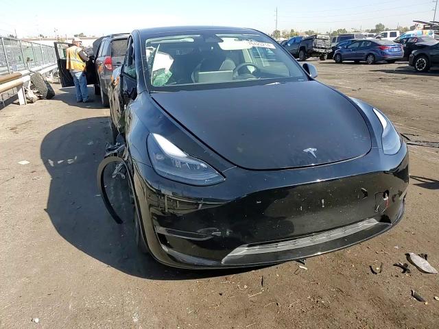 2023 Tesla Model Y VIN: 7SAYGDEF5PF610915 Lot: 76420214