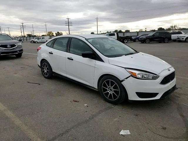 2015 Ford Focus S VIN: 1FADP3E29FL257082 Lot: 76403314