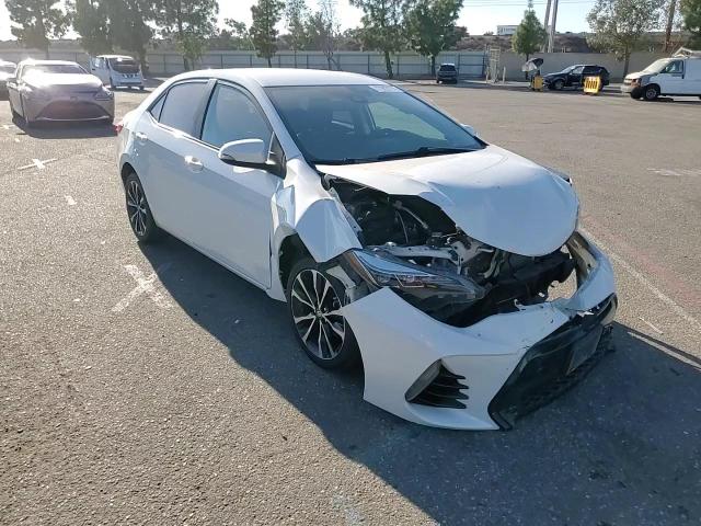 2018 Toyota Corolla L VIN: 5YFBURHE9JP801759 Lot: 77903774