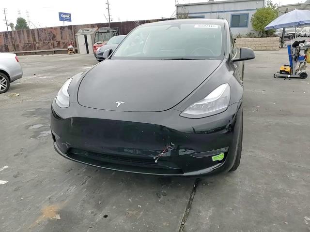 2023 Tesla Model Y VIN: 7SAYGDEF5PF830734 Lot: 76607114