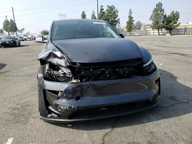 2026 Tesla Model Y VIN: 7SAYGDED5TF404728 Lot: 87310995