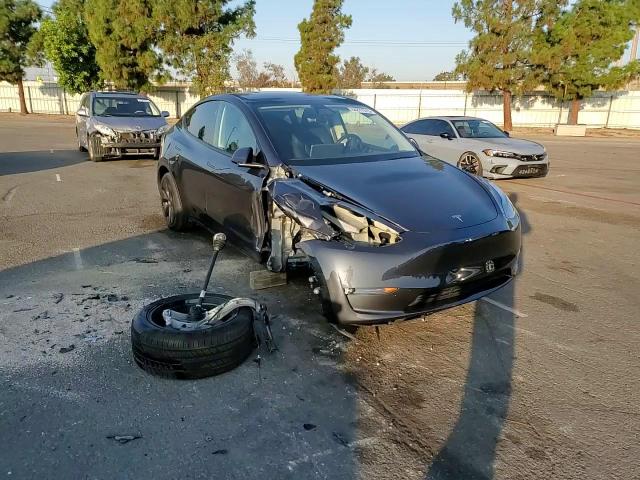 2025 Tesla Model Y VIN: 7SAYGDEE2SF248557 Lot: 84877515
