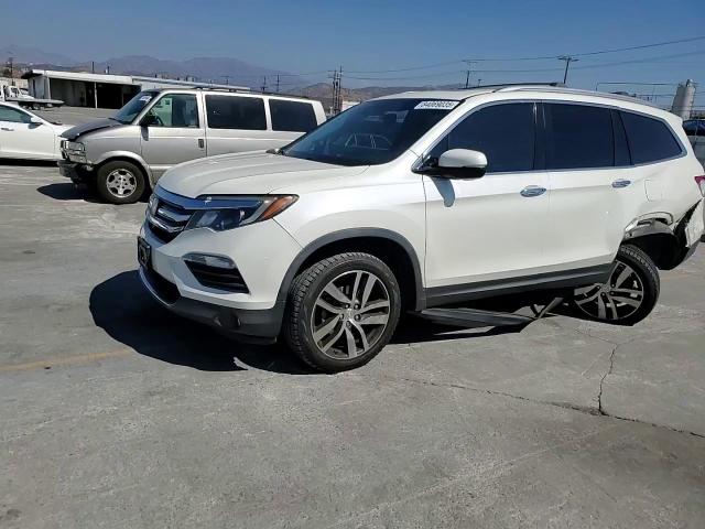 2018 Honda Pilot Touring VIN: 5FNYF5H99JB008909 Lot: 84069035