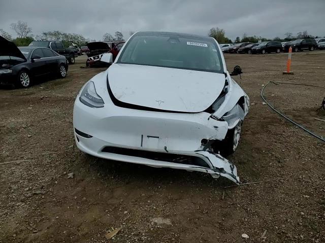 2023 Tesla Model Y VIN: 7SAYGAEE1PF593990 Lot: 86592595