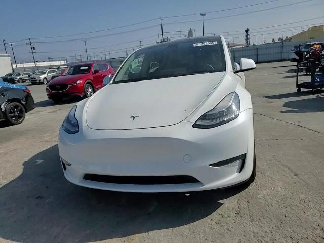 2023 Tesla Model Y VIN: 7SAYGDEE3PA034231 Lot: 90303035