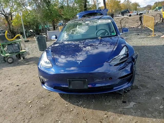 2018 Tesla Model 3 VIN: 5YJ3E1EB7JF080947 Lot: 90859095