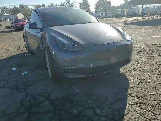 2023 Tesla Model Y VIN: 7SAYGAEE0PF621181 Lot: 89871235