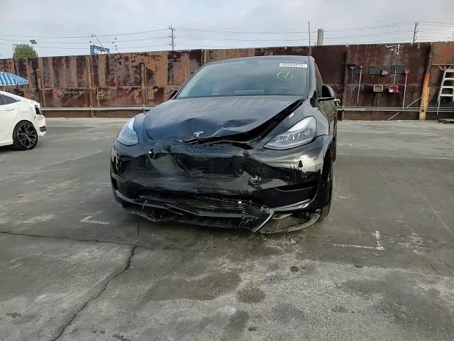 2023 Tesla Model Y VIN: 7SAYGDEF1PF665085 Lot: 82635915