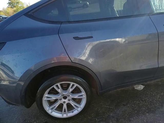 2023 Tesla Model Y VIN: 7SAYGDEE8PA128427 Lot: 84264955
