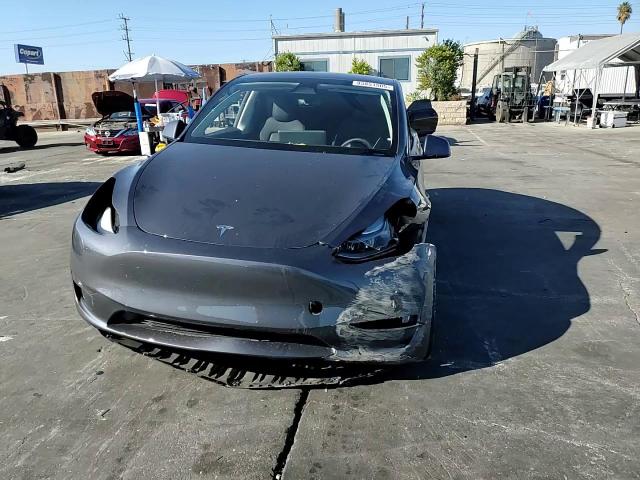 2023 Tesla Model Y VIN: 7SAYGDED1PF977065 Lot: 85851505