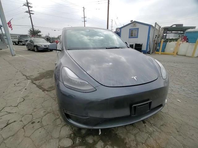 2023 Tesla Model Y VIN: 7SAYGDEE9PF889177 Lot: 82357825