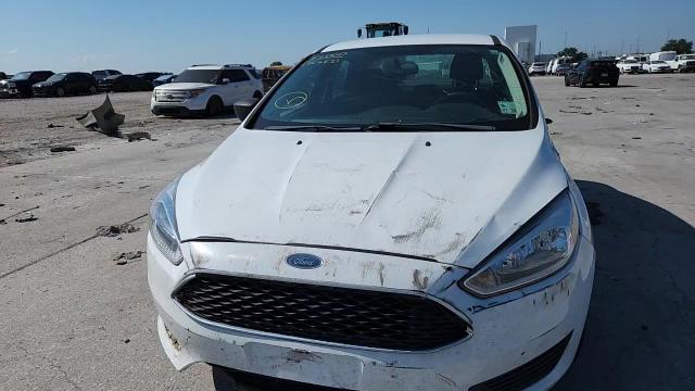 2018 Ford Focus S VIN: 1FADP3E29JL299423 Lot: 84582485