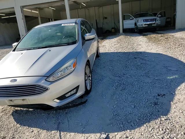 2016 Ford Focus Titanium VIN: 1FADP3N26GL302478 Lot: 86282875