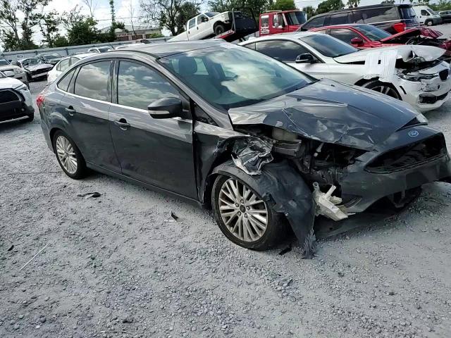 2015 Ford Focus Titanium VIN: 1FADP3J27FL322047 Lot: 82182475