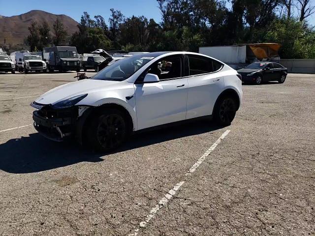 2023 Tesla Model Y VIN: 7SAYGAEE9PF634799 Lot: 84073495
