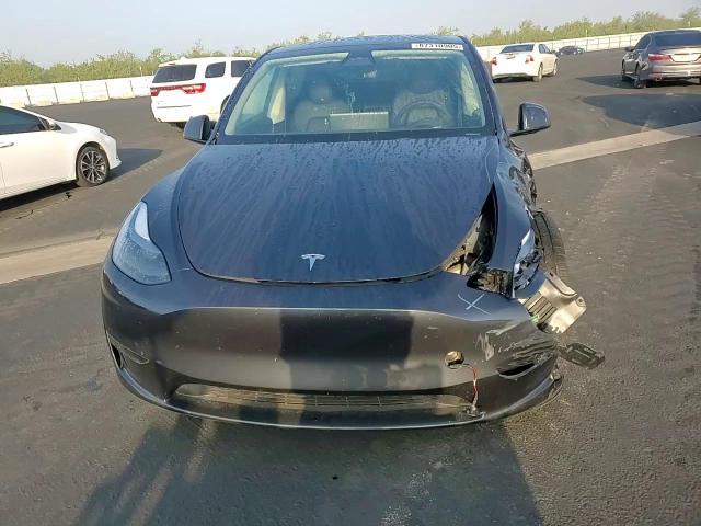 2025 Tesla Model Y VIN: 7SAYGDED8SF319185 Lot: 87310905