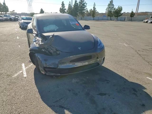 2025 Tesla Model Y VIN: 7SAYGDED2SF218708 Lot: 89476395