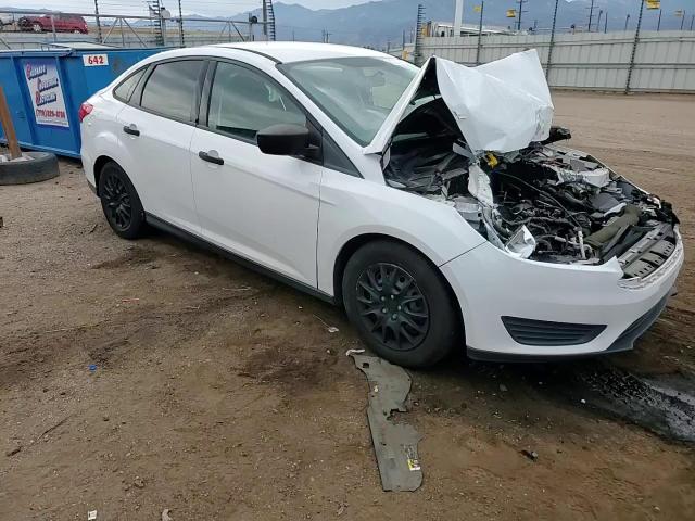 2015 Ford Focus S VIN: 1FADP3E24FL221235 Lot: 82374575