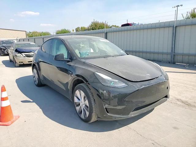 2023 Tesla Model Y VIN: 7SAYGDED4PF940057 Lot: 84916925