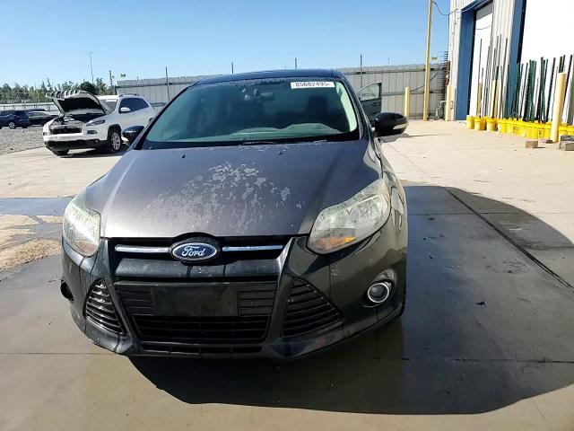2013 Ford Focus Titanium VIN: 1FADP3J24DL263424 Lot: 85682495