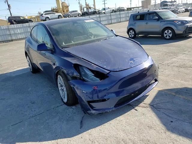 2023 Tesla Model Y VIN: 7SAYGDEE4PF871346 Lot: 84728695