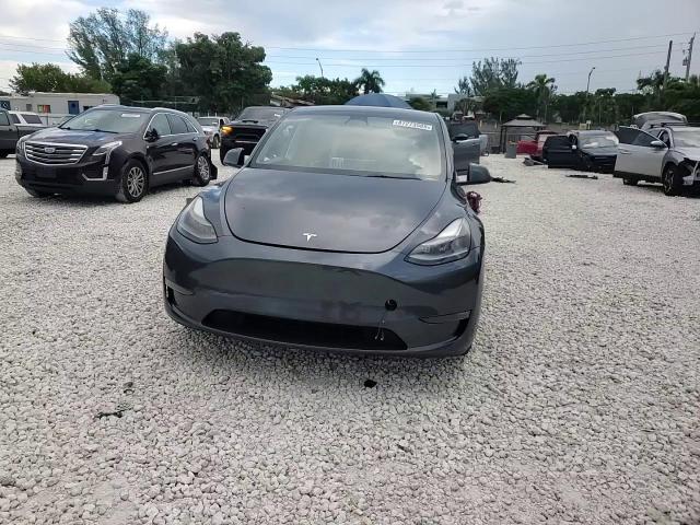 2023 Tesla Model Y VIN: 7SAYGDEFXPF584635 Lot: 87273585