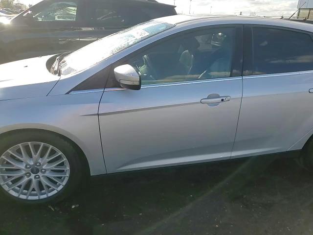 2014 Ford Focus Titanium VIN: 1FADP3N26EL194599 Lot: 79344684