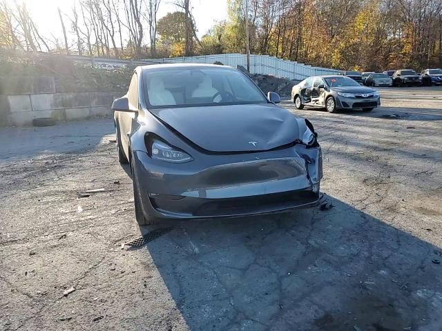 2023 Tesla Model Y VIN: 7SAYGDEEXPF887602 Lot: 79509404