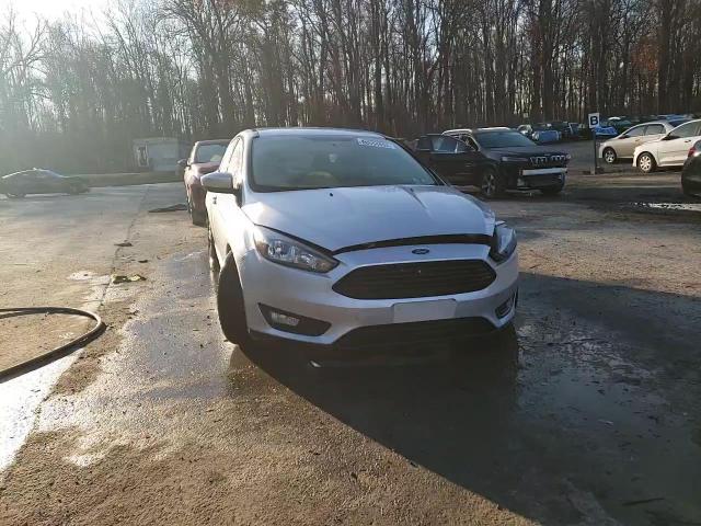 2018 Ford Focus Se VIN: 1FADP3FE7JL214135 Lot: 80554694