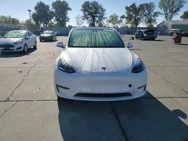 2023 Tesla Model Y VIN: 7SAYGDEE6PF697828 Lot: 80135524