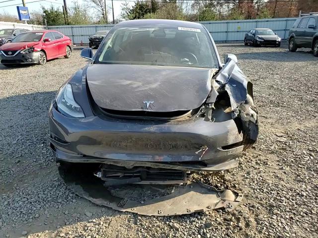 2018 Tesla Model 3 VIN: 5YJ3E1EB7JF087106 Lot: 79389644