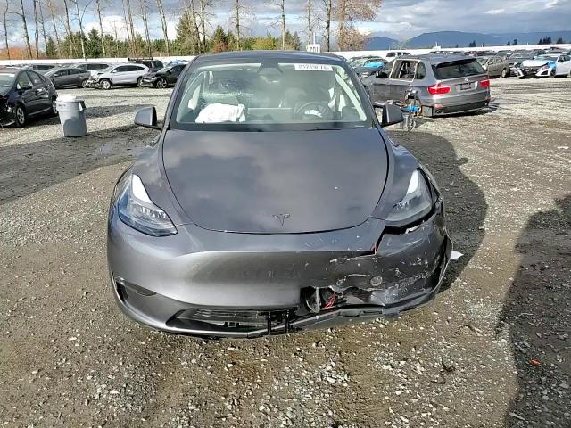 2023 Tesla Model Y VIN: 7SAYGDEF3PF940469 Lot: 81219674