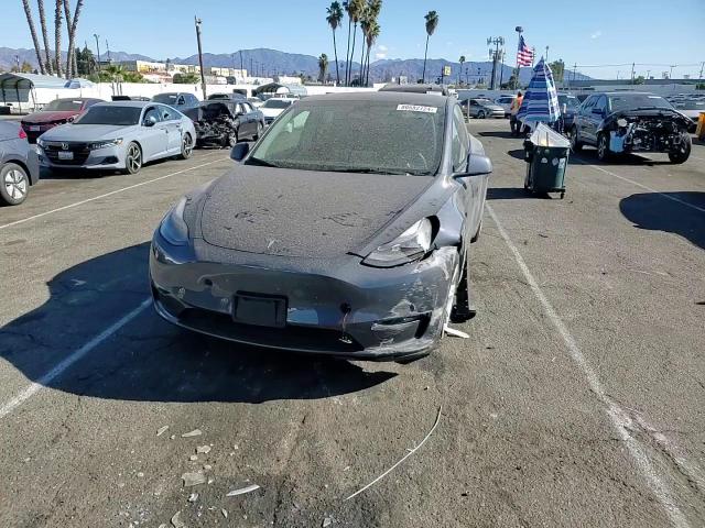 2023 Tesla Model Y VIN: 7SAYGDEE4PF606670 Lot: 80582724