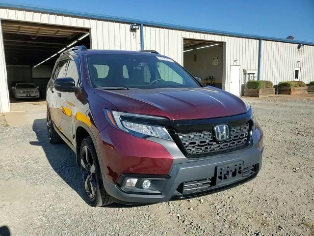 2021 Honda Passport Elite VIN: 5FNYF8H02MB020777 Lot: 91899065
