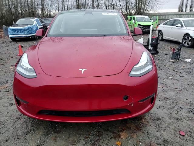 2023 Tesla Model Y VIN: 7SAYGDEE5PA105087 Lot: 94372695