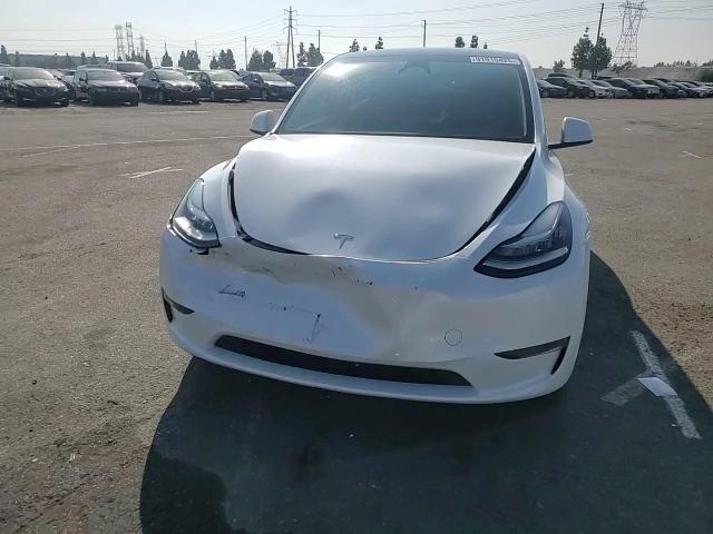 2023 Tesla Model Y VIN: 7SAYGDEE2PA130013 Lot: 91915425