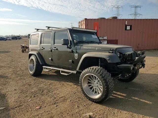 2011 Jeep Wrangler Unlimited Rubicon VIN: 1J4BA6H16BL565225 Lot: 91453585