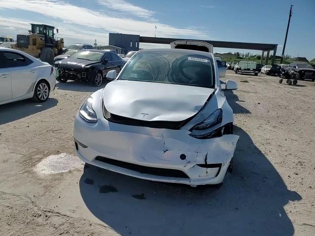 2023 Tesla Model Y VIN: 7SAYGDEE4PA025098 Lot: 90648895
