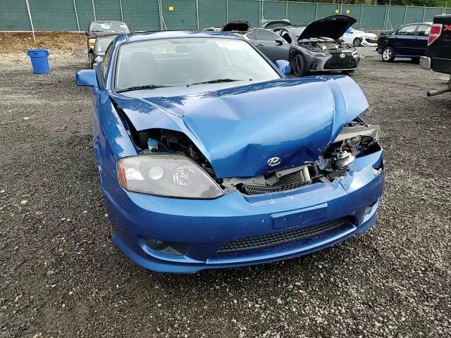 2005 Hyundai Tiburon VIN: KMHHM65DX5U168083 Lot: 91311075