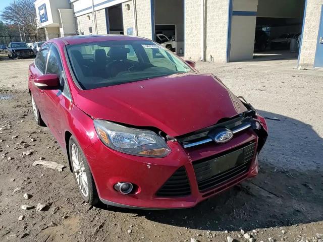2014 Ford Focus Titanium VIN: 1FADP3J21EL104555 Lot: 94119355