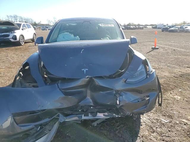 2023 Tesla Model Y VIN: 7SAYGDEE2PF858076 Lot: 91689215