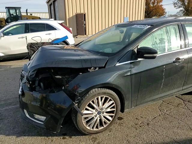 2015 Ford Focus Titanium VIN: 1FADP3J29FL376160 Lot: 93744585
