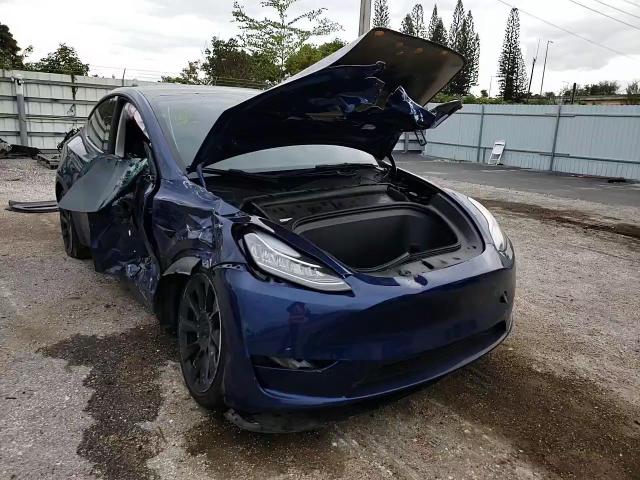 2023 Tesla Model Y VIN: 7SAYGAEE9PF607117 Lot: 81387353