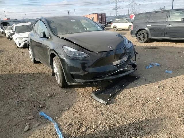 2023 Tesla Model Y VIN: 7SAYGDEEXPF798712 Lot: 83088924