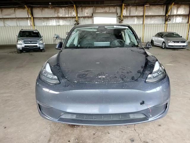 2023 Tesla Model Y VIN: 7SAYGDEE3PA098768 Lot: 84630194