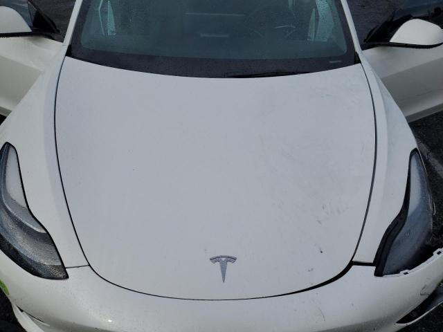 5YJ3E1EA7NF307034 Tesla 2022
