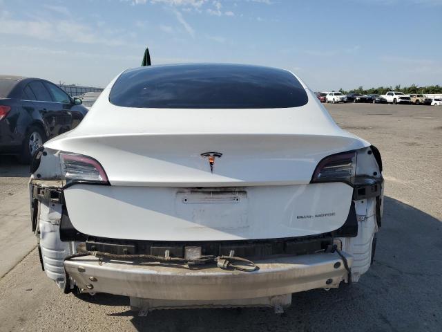 5YJ3E1EB0MF997183 Tesla 2021